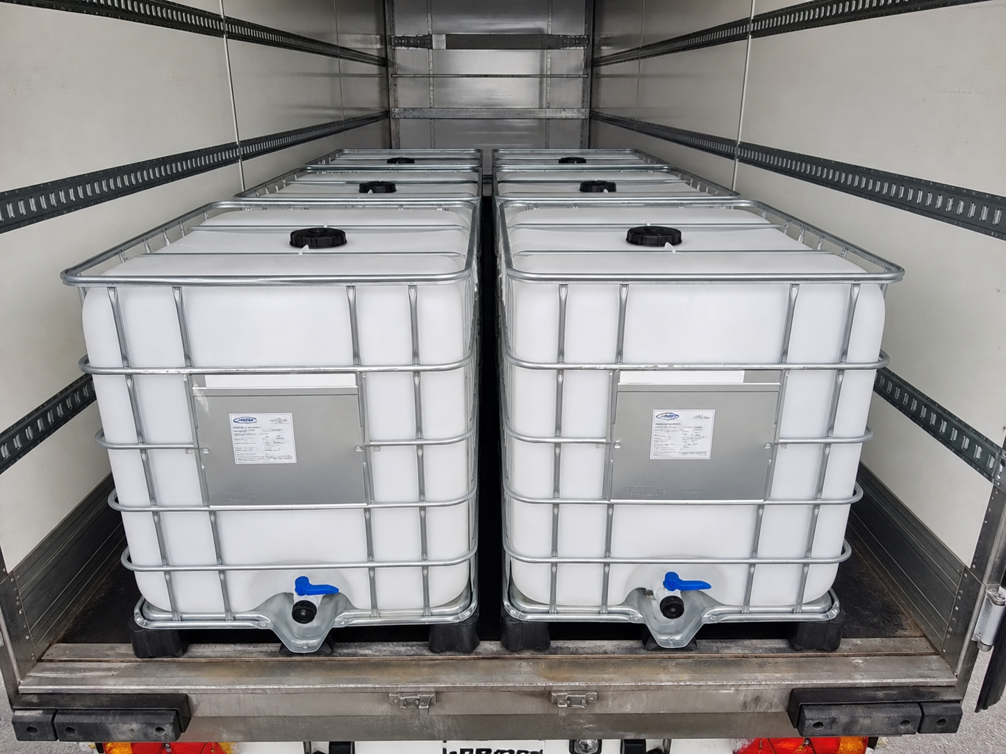 Clean, ready-to-fill reconditioned IBC totes loaded for delivery